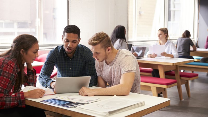 University Students Working In Classroom