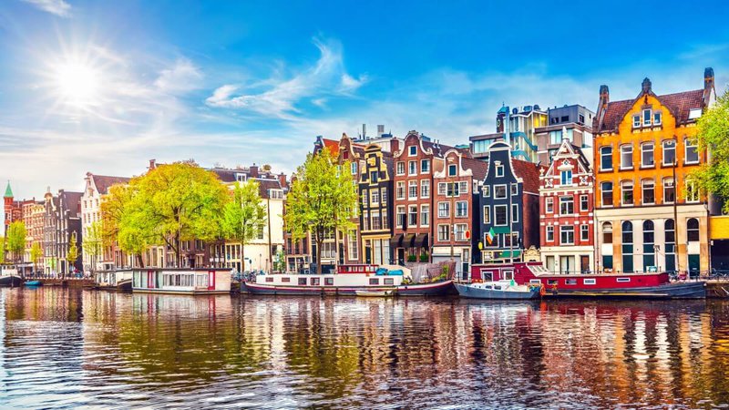 Amsterdam Netherlands dancing houses over river Amstel