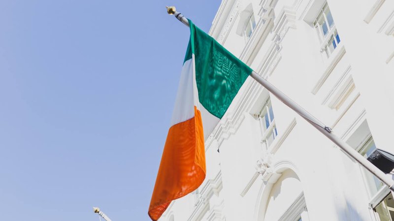 Irish flag waving off a building in Grafton Street, Ireland