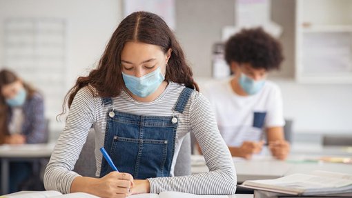 University students wearing masks in classrooms