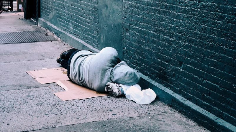 Student sleeping on the street