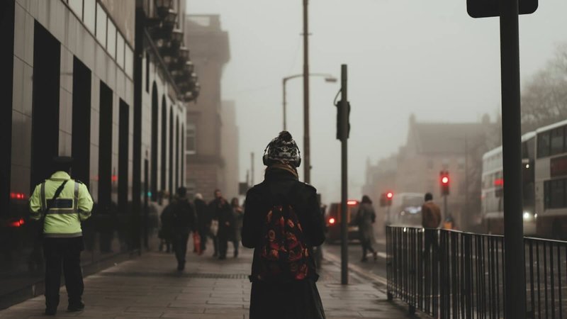 Young woman walking in the city center in Edinburgh, United Kingdom
