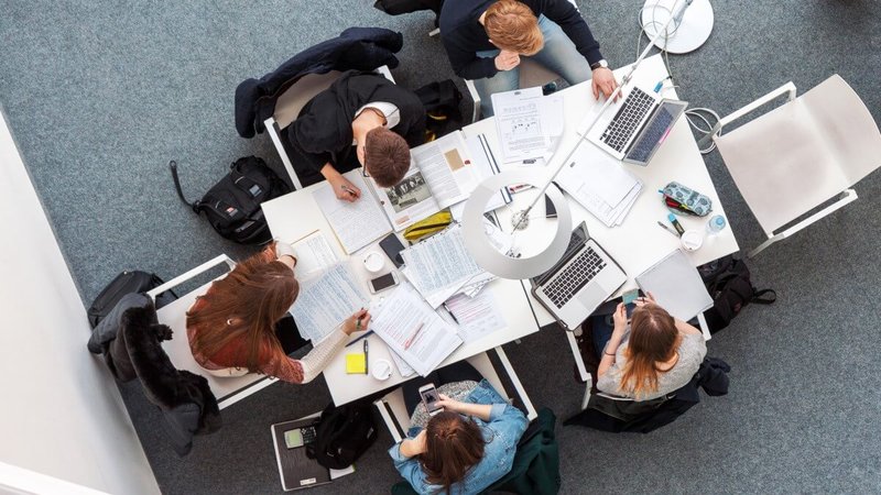 female and male students studying together