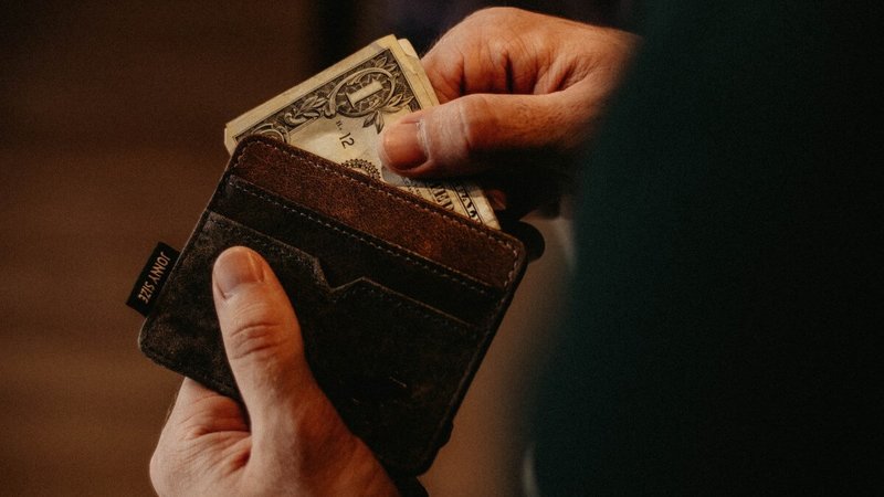 man holding an empty wallet