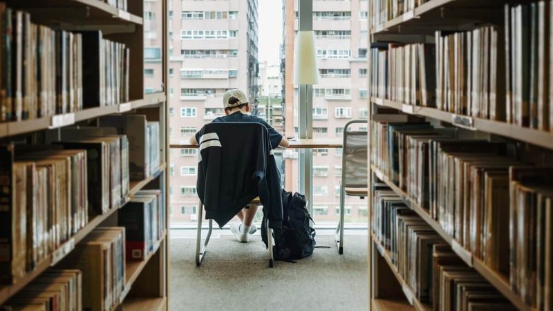 student at library