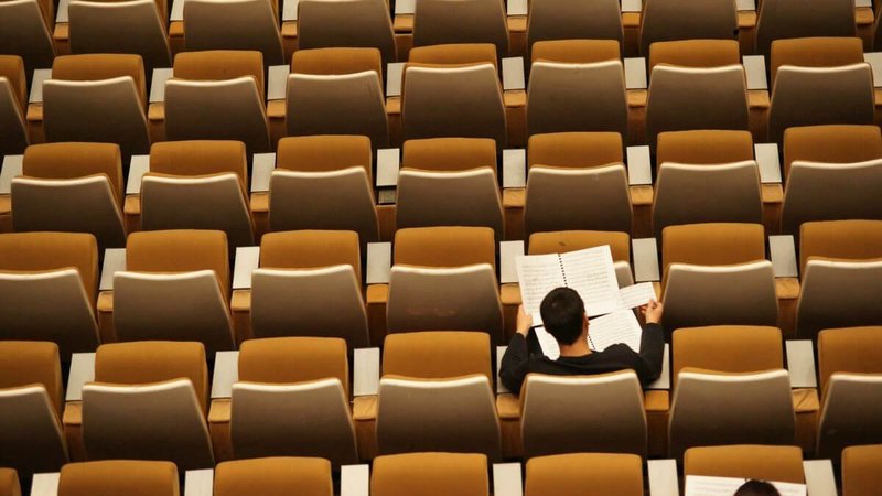 student in an empty classroom