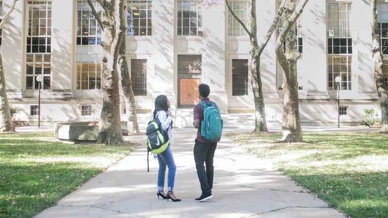 students in front of a building