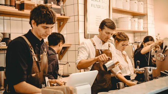 young people working in a coffee shop